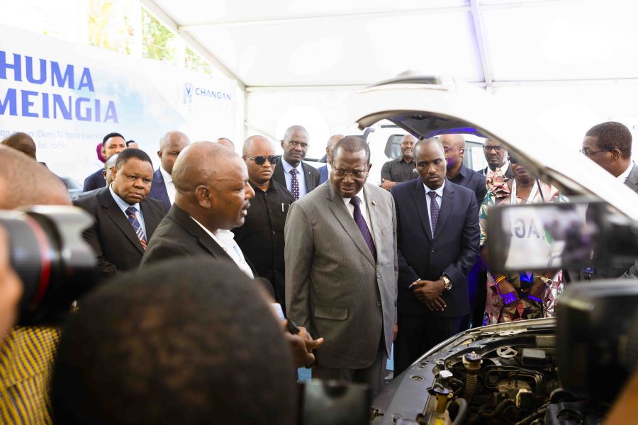 Tanzania’s Vice President, H.E. Philip Mpango (centre), accompanied by the Deputy PM and Minister for Energy, H.E. Dotto Biteko (right), and other leaders visits a stand with a car whose engine runs on natural gas at the EAPCE’25.