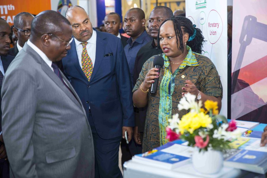 EAC Secretary General Hon. Veronica Nduva (right) with Tanzania’s Vice President, H.E. Philip Mpango (left, in grey suit) at the EAC Stand at the 11th EAC Petroleum Conference & Exhibition at the Julius Nyerere International Convention Centre in Dar es Salaam, Tanzania. This was shortly before the Vice President officially opened the three-day conference.